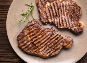 Grilled beef steak and rosemary on plate